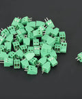 50 PCS 2 Pin 2.54mm Pitch PCB Screw Terminal Block Connectors Plastic Universal PCB Mount Assortment Kit For DIY Electronics Projects Including USB Wiring scattered on a surface