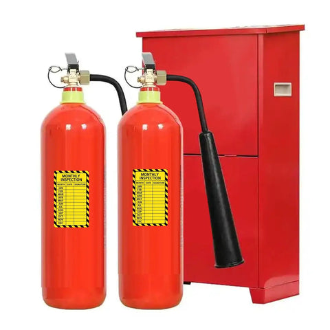 Two fire extinguishers with yellow Monthly Inspection Stickers 3x5 Inch Weatherproof Labels for Facility, Machinery, and Fire Extinguisher Maintenance displayed.