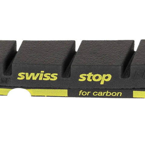 Close-up of FlashPro Black Prince Rim Brake Pad for carbon rims, showing SwissStop branding, part of a 4 pack for carbon and aluminum rims.