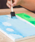 Heavy Duty Paint Roller Kit With Precision Trim Brush For Tough Corners And Crisp Lines Quick Roll Setup yielding blue sky painting on canvas.