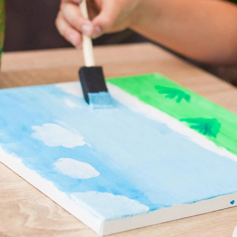 Heavy Duty Paint Roller Kit With Precision Trim Brush For Tough Corners And Crisp Lines Quick Roll Setup yielding blue sky painting on canvas.