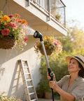 Person using Lightweight Watering Wand With 6 Spray Modes For Hanging Baskets And Windows, 22 Inch Reach, outdoors on flowers