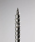 Close-up of Badass Premium 14 X 5 Inch Type 316 Marine Grade Stainless Steel Wood Screws T27 Flat Head, showing sharp tip.