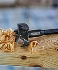 Self Feed Drill Bit Kit 8 Piece For Wood With 7/16 Inch Quick Change Shank on wood with shavings