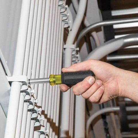 Magnetic Multi-Bit Screwdriver And Nut Driver, 11-In-1 With Eight Bit Tips And Three Nut Driver Sizes in use on metal frame