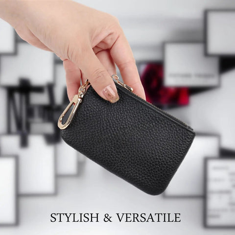 Hand holding a Full Grain Leather Coin Purse And Keychain Wallet With Slick Pull Zipper Closure Handy Card Slots Stylish Matte Black Finish.