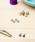 Dope M5 Iron Chicago Screws For Bag Repair And Jean Fastening 110 Piece Heavy Duty Rivet Hardware Set For Diy Crafting, laid on a wooden table.