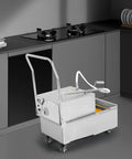 Pro Grade Mobile Fryer Oil Filter Cart Featuring A Rock Solid 550 Watt Pump And Slick Grease Trapping Mesh in a modern kitchen.