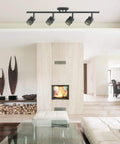 Norris 4-Light Track Lighting in Oil Rubbed Bronze With Champagne Glass Heads in modern living room setting