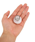 White Silicone Bathtub Drain Stopper with Ring for Kitchen Sinks shown in hand for size reference and usability demonstration.
