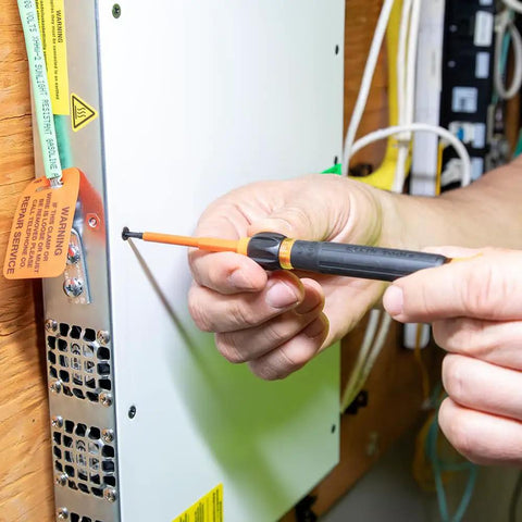 Using 8-In-1 Insulated Screwdriver Set With Case 1000V Rated on electrical panel, showcasing Phillips 00 and 0 precision.