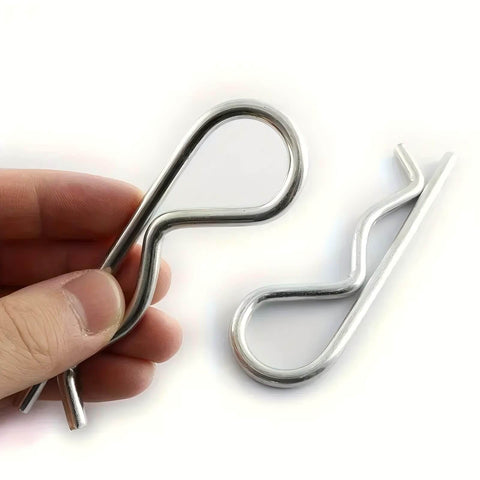 10 Pack Spring Hitch Cotter Hair Pins And White Zinc Plated Retaining Wire Clips For Trailers And Equipment, shown in hand and on surface