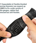 Hands holding and stretching 100 Ft PET Expandable Braided Wire Sleeving One Quarter Inch Black Cable Loom for protection