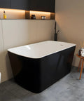 Premium Freestanding Acrylic Oval Soaking Bathtub 67 Inch Deep Soak Basin With Sleek Chrome Drain in modern bathroom setting.