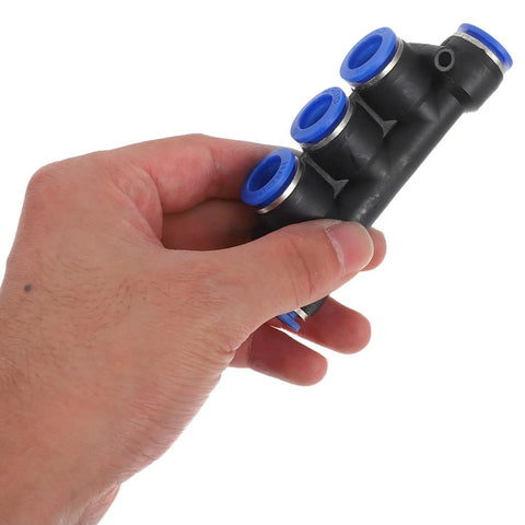 Top Tier 8-Piece Plastic Pneumatic Connector Kit With Push To Connect Fittings For Lightweight Air Compressor Use In Industrial Automation Systems And Diverse Tube Specs., black plastic pneumatic connector with blue push-fit ports held in hand