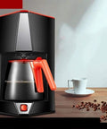 Top Shelf Automatic Espresso Maker crushing your morning grind with sleek design and orange accents on countertop.