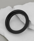 M48 To M54 Telescope Thread Conversion Adapter For Photography Lenses, black aluminum ring viewed on white marble surface.