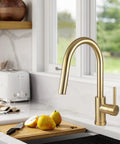 Brushed Gold Kitchen Faucet With Pull Down Sprayer Solid Brass Construction Single Hole Mount With Deck Plate One Handle No Fuss Setup Reach Technology And Flexible Swivel Hose For Easy Sink Access in modern kitchen setting
