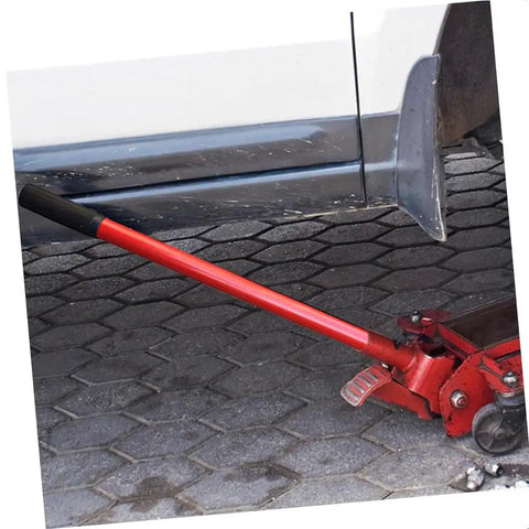 Rock Solid Vertical Hydraulic Bottleneck Jack For Cars 5 To 10 Ton Capacity Red Compact Portable Design With Tough Carbon Steel Handle in use under vehicle.