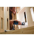 Worker using 18V EC Brushless Oscillating Multi Tool With StarlockPlus Quick Change System for plunge cut in wooden structure.