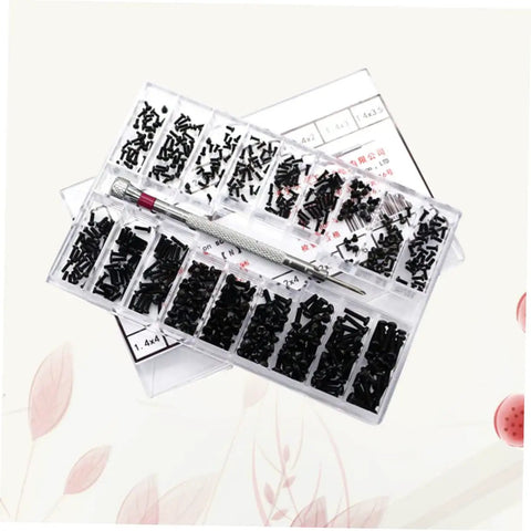 Heavy Duty Small Screw Assortment Kit Featuring 18 Miniature Flat Head Machine Screws Forged From Solid Carbon Steel Inside A Compact Carrying Case Ideal For Notebook Or Glasses Fixes Smooth Sailing With Zero Sweat with black screws organized in a transparent case.