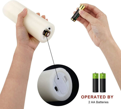 Inserting AA batteries into Flameless Wax Pillar Candles Set With Remote And 24 Hour Timer Battery Operated LED Candles Ivory 9 Pack