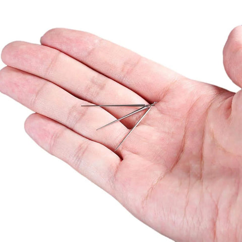 Hand holding Titanium Piercing Kit 14G 16G 18G 20G ASTM F136 Hypoallergenic Threadless Push In Taper Insertion Pins
