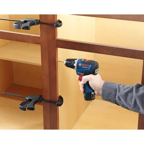 Person using 12V Max EC Brushless 3/8 Inch Drill Driver Kit With Ultra Lightweight 1.6 Lb Tool on wooden furniture for DIY projects