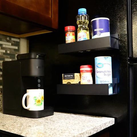 2 Pack Magnetic Shelves For Washer And Fridge Each Holds 12 Lbs Black Steel Kitchen Organizer For Spices Jars Vitamins And More Space Saving Magnetic Rack For Laundry Room And Pantry shown installed holding spices and jars on fridge.