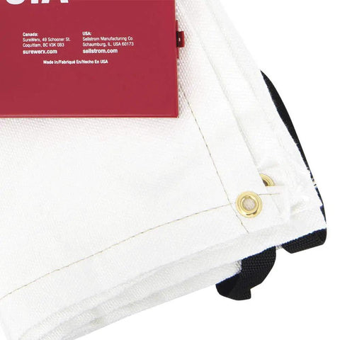Edges of emergency fire blanket with brass grommets beside red steel cabinet. Emergency Fire Blanket With Red Steel Cabinet 6 By 5 Feet Fiberglass Material High Temperature Resistant And Chemical Resistant Lightweight Durable Quick Access Wall Mount Safety Kit For Home Workshop Or Commercial Use visible partially.