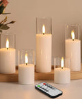 Clear Glass Flameless Candles With Remote Set Of 5 Slim Tall LED Pillar Candles Battery Powered on table with remote