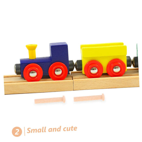 Miniature Wooden Nails Set For DIY Crafts And Woodworking, 20 Pieces Of Solid Wood T Nails For Train Wheel Projects shown next to toy train