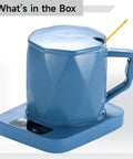 Ceramic coffee cup warmer with durable heating pad, cool blue hue, designed to keep drinks at 55 degrees for lazy Sundays.