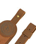 Close-up of brown Canvas Leather Rifle Sling With 14 Shell Slots For 22 Caliber Ammunition Storage, showcasing buckle and stitching.