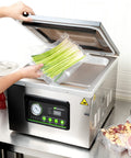Pro Grade Chamber Vacuum Sealer Packs A Solid Punch With Sturdy 16 Inch Seal Bar And Whisper Quiet Motor, sealing fresh green onions.
