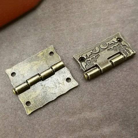 Straight Up Mini Vintage Brass Cabinet Hinge With Antique Drawer Catch For Wooden Furniture Restoration, showing two hinges from above.