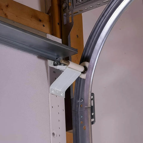 Installed heavy duty 2mm steel garage door track rails with R12 radius curved design, horizontal tracks for 7 foot high doors.