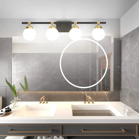 Four Light Mid Century Modern Bathroom Vanity Light Fixtures Over Mirror In Black And Gold With Milk White Glass Globes Wall Mount Vanity Lighting For A Warm Luxe Bath Updated Look, above a bathroom mirror and sink.