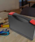 Portable Plastic Toolbox With Grip Handle, Heavy Duty Hard Shell Organizer For Mechanics, tough workcase on wooden surface.