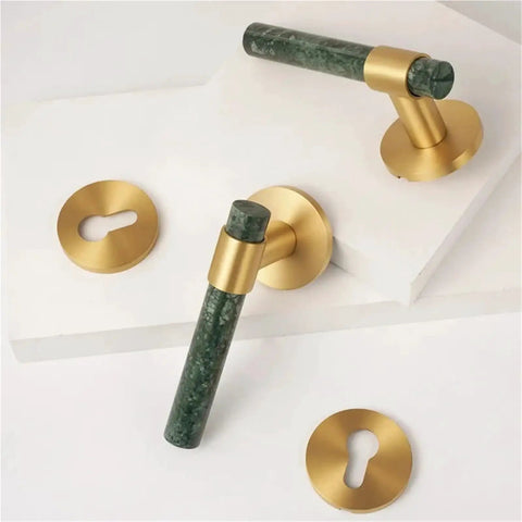 Lux Marble Look Brass Door Lock Set with Nordic Style Handles, shown on a white background with brass keyhole plates.