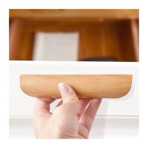 Hand holding Wooden Cabinet Drawer Pull Handles For Wardrobes And Furniture Knobs With Natural Wood Grain Finish Easy Install