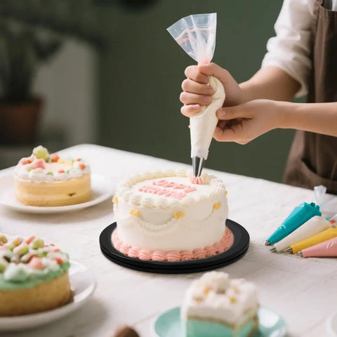 Person decorating cake on 8 Inch Heavy Duty Rotating Swivel Stand With 360 Degree Rotation And Steel Ball Bearings.
