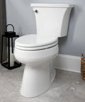 Heavy Duty White Elongated Toilet Seat With Dead Quiet Slow Close Action And Reinforced Wood Core in a modern bathroom.