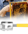 Stainless Steel Beehive Knife Scraper and Honey Uncapping Fork for Beekeeping Equipment in front of honeycomb frame.