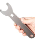 Hand holding pin wrench from Hydraulic Steering Cylinder Seal Kit With Pin Wrench HS5157 For Marine Boats.