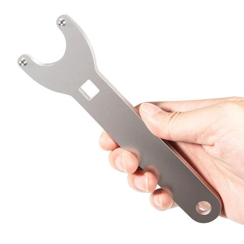 Hand holding pin wrench from Hydraulic Steering Cylinder Seal Kit With Pin Wrench HS5157 For Marine Boats.
