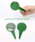 Hand holding a green seed dial with five settings from Six Pack Seed Sowing Dispenser Set with Adjustable Garden Hand Planter Seeder Tool