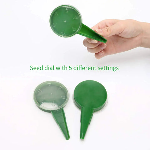 Hand holding a green seed dial with five settings from Six Pack Seed Sowing Dispenser Set with Adjustable Garden Hand Planter Seeder Tool