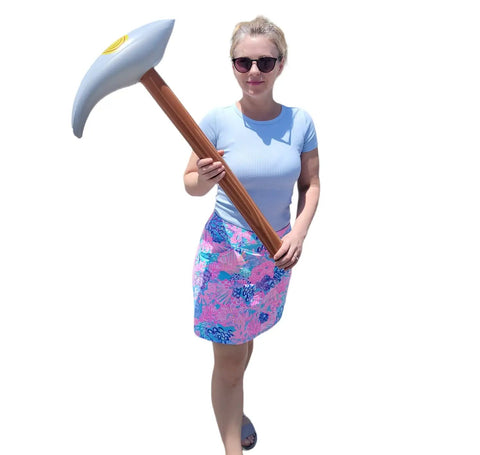 Person holding Inflatable Pick Axe Prop 33 Inch Wood And Silver Mining Tool for Party Decor And Themed Events
