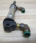 Front view of Industrial Hydraulic Cylinder 10mm Bore With Two And One Half Inches Stroke PN 13316050001 on a wooden surface.